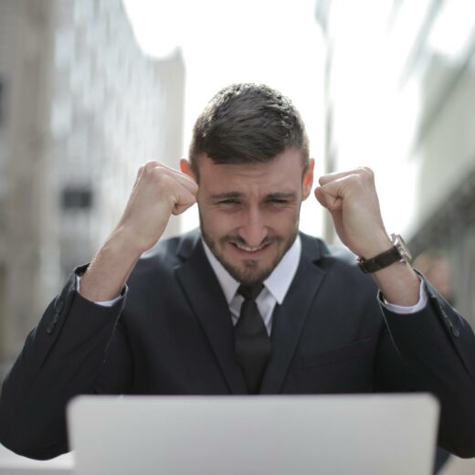 man in black suit achieved an accomplishment