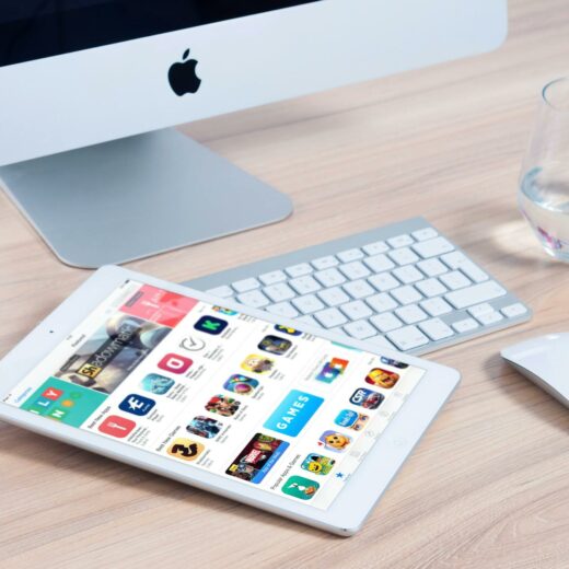 white tablet computer on apple magic keyboard near apple magic mouse