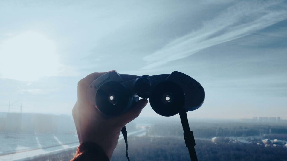 a person holding binoculars